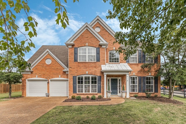 front facade with a garage and a front yard