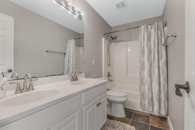 full bathroom featuring toilet, vanity, and shower / tub combo