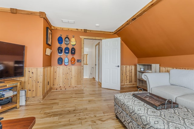 bedroom featuring vaulted ceiling and light hardwood / wood-style floors