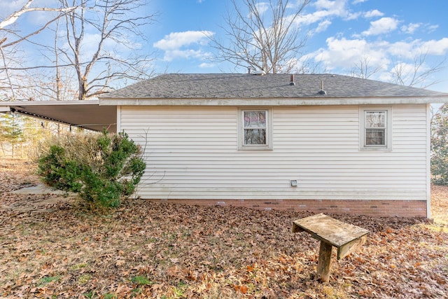 view of property exterior with a carport