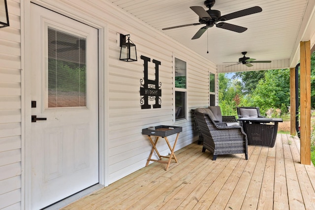 wooden deck with ceiling fan