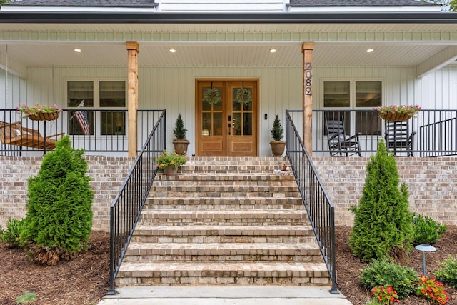 property entrance with french doors and a porch