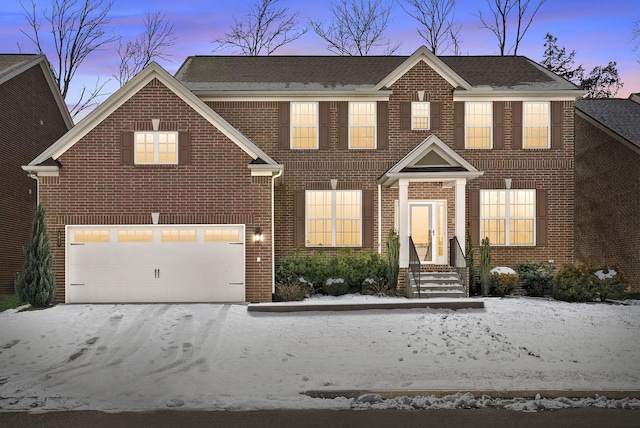 view of front of property featuring a garage