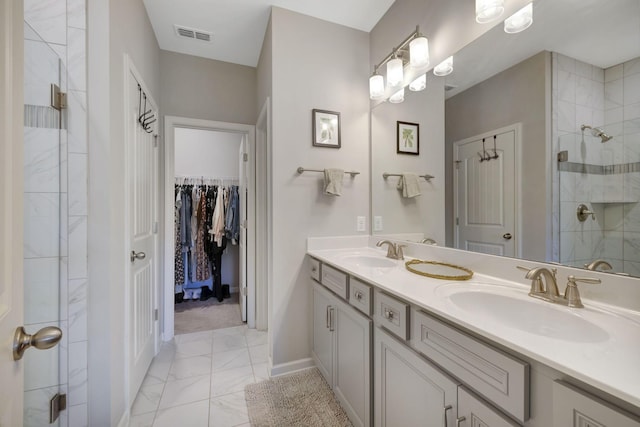 bathroom with an enclosed shower and vanity