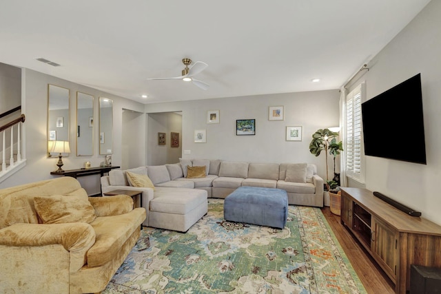 living room with ceiling fan and hardwood / wood-style floors