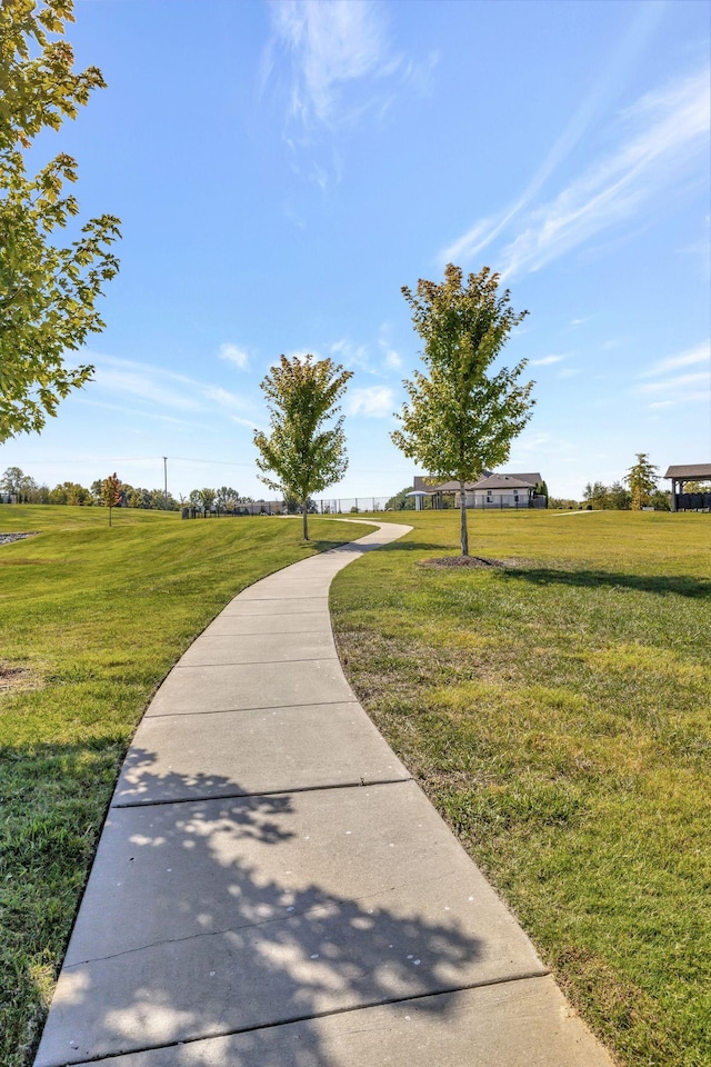 view of property's community featuring a yard