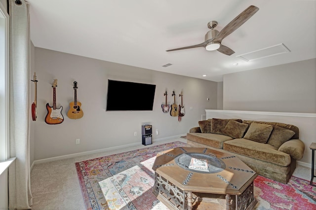 carpeted living room featuring ceiling fan