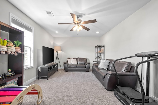 living room featuring ceiling fan and light carpet