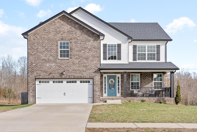 view of property featuring covered porch, a garage, and a front lawn