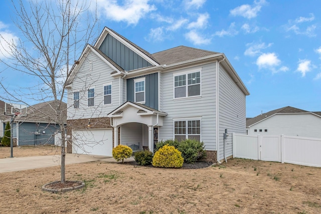 view of front of house with a front yard and a garage