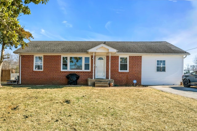 ranch-style home with a front yard