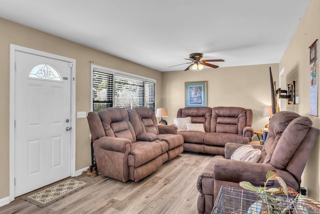 living room featuring ceiling fan and light hardwood / wood-style floors