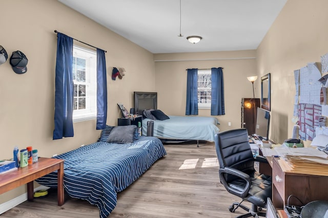 bedroom with light wood-type flooring