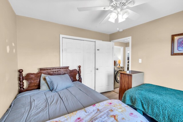 bedroom featuring washer / clothes dryer, a closet, and ceiling fan