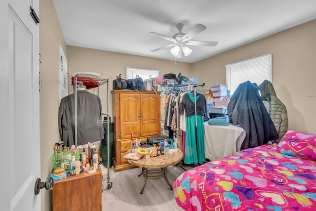 bedroom featuring ceiling fan and light hardwood / wood-style flooring