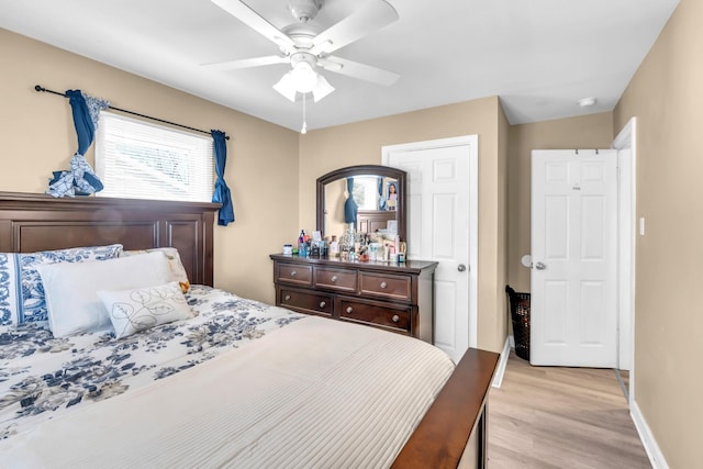 bedroom featuring light hardwood / wood-style floors and ceiling fan