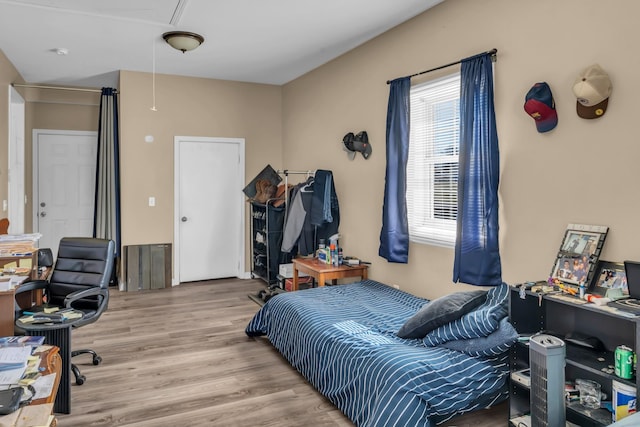 bedroom featuring hardwood / wood-style flooring