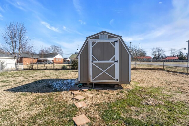 view of outbuilding with a yard