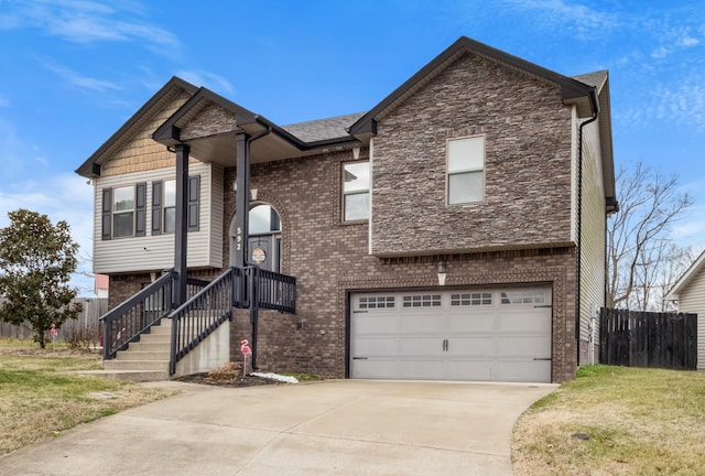 view of front of house featuring a garage and a front lawn