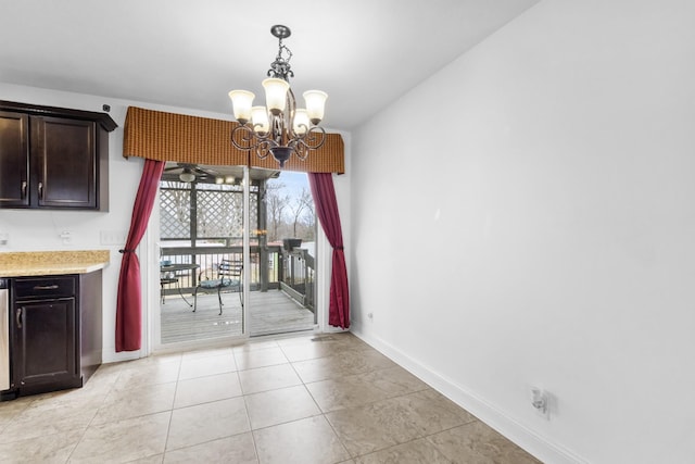 unfurnished dining area with a notable chandelier and light tile patterned floors