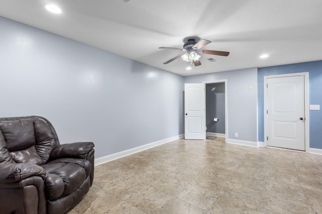 sitting room featuring ceiling fan