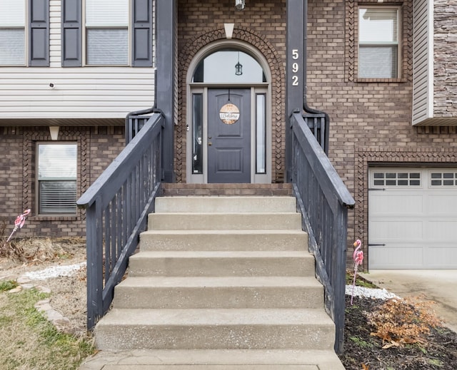 view of exterior entry featuring a garage