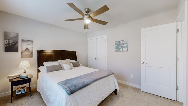 bedroom with light carpet, ceiling fan, and a closet