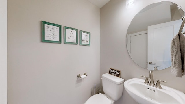 bathroom with toilet and sink