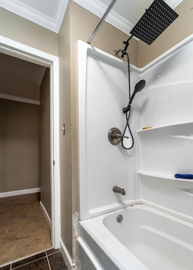 bathroom with tile patterned flooring,  shower combination, and ornamental molding