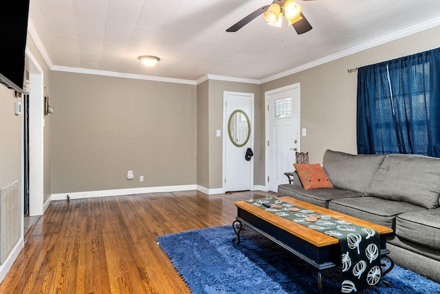 living room featuring ceiling fan, ornamental molding, and hardwood / wood-style flooring