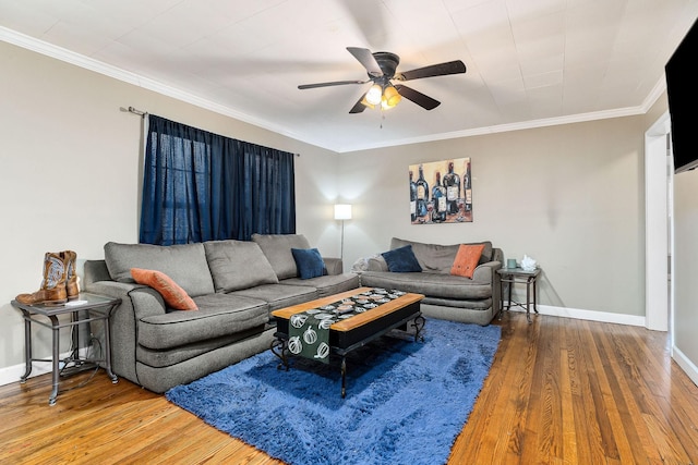 living room featuring ceiling fan, ornamental molding, and hardwood / wood-style floors