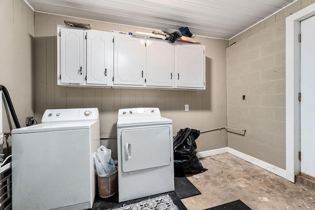 washroom featuring cabinets and washing machine and dryer