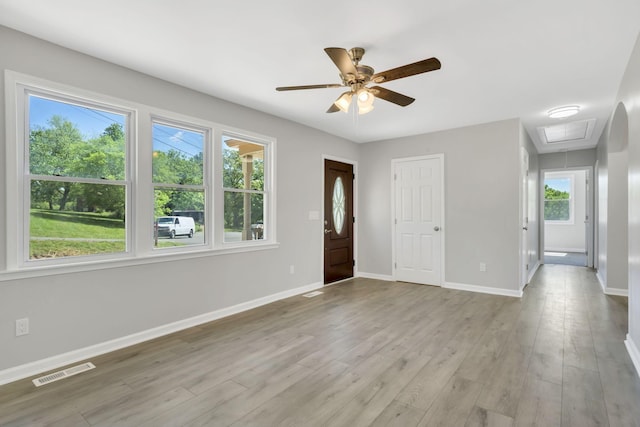 foyer featuring ceiling fan and light wood-type flooring