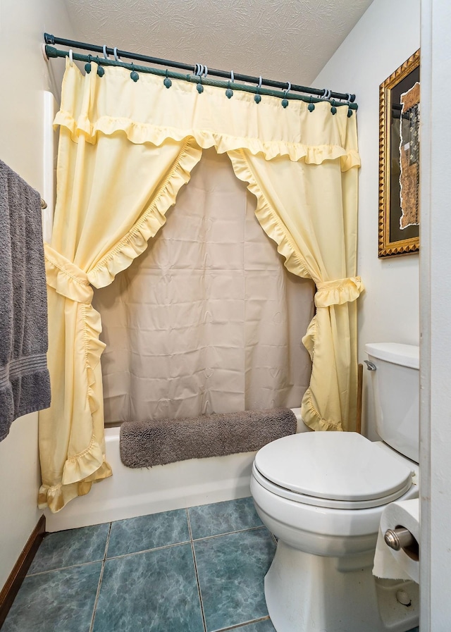 bathroom featuring tile patterned floors, a textured ceiling, toilet, and shower / tub combo with curtain