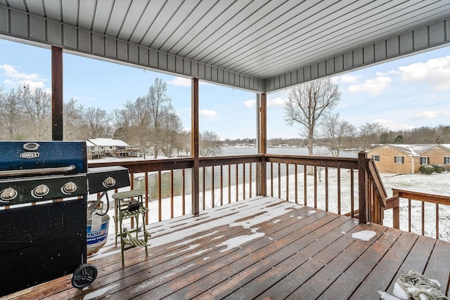 snow covered deck featuring a grill