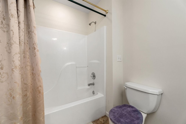 bathroom with toilet and shower / tub combo