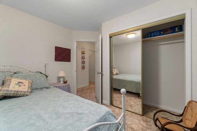 bedroom with a closet and carpet flooring