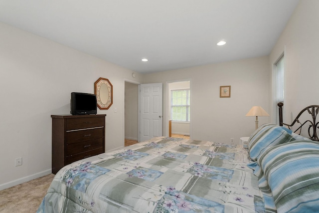 bedroom featuring light carpet