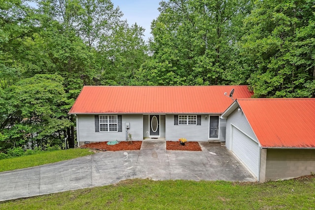 single story home featuring a front yard and a garage