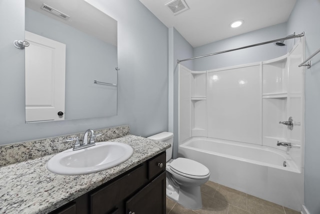 full bathroom featuring washtub / shower combination, toilet, tile patterned flooring, and vanity