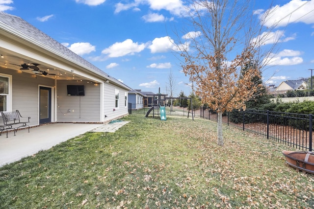 view of yard with a patio, a playground, and ceiling fan