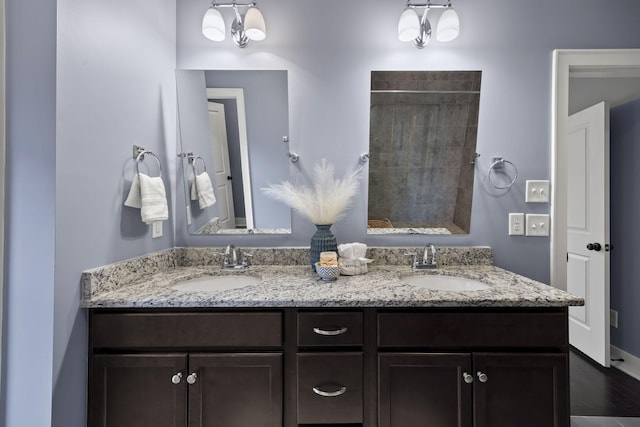 bathroom with vanity and walk in shower