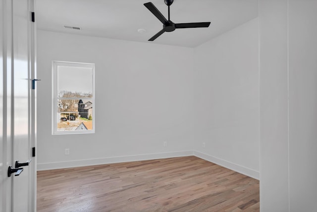 unfurnished room featuring light hardwood / wood-style flooring and ceiling fan