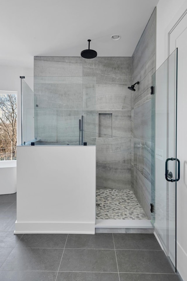 bathroom with tile patterned flooring and plus walk in shower