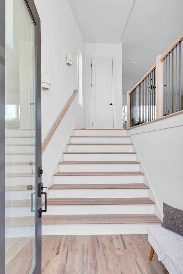 stairs with wood-type flooring