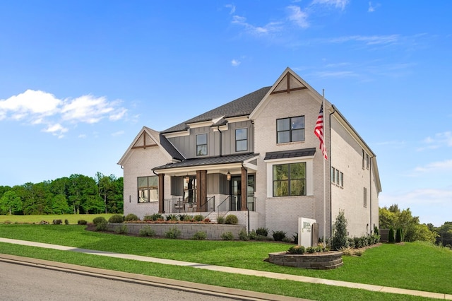 view of front facade featuring a front lawn and a porch