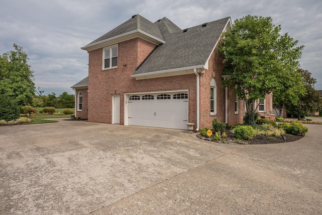 view of side of home with a garage