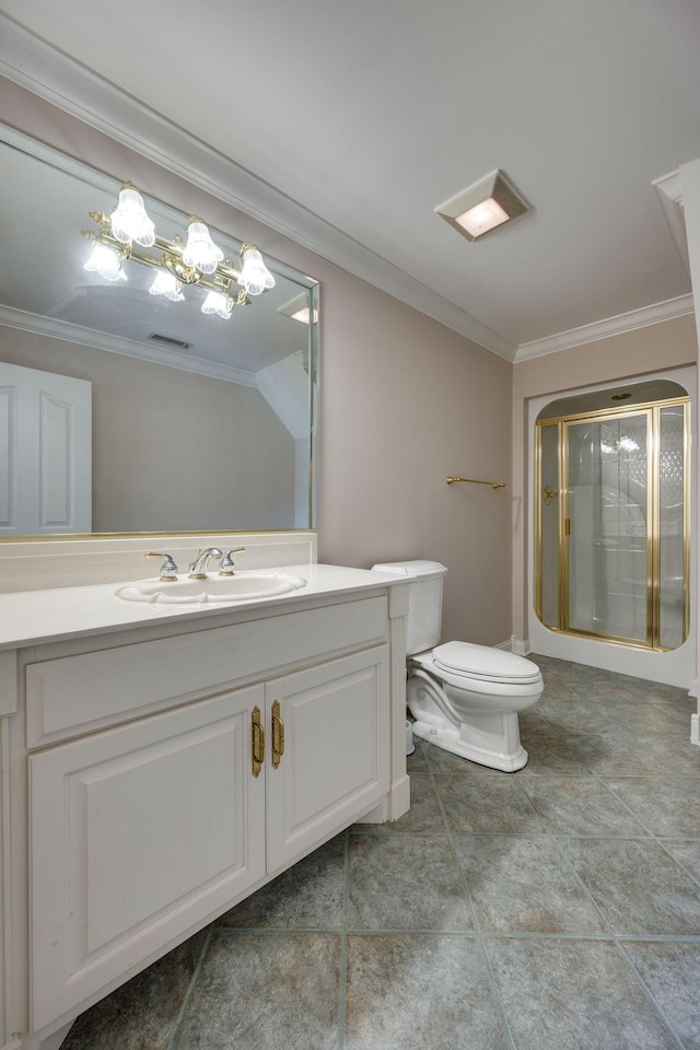 bathroom with vanity, crown molding, a shower with shower door, and toilet