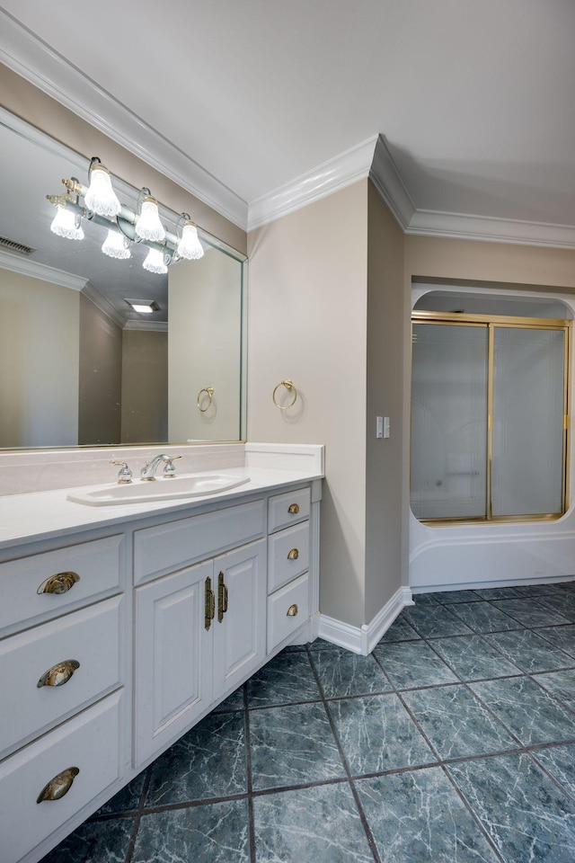 bathroom featuring crown molding, combined bath / shower with glass door, and vanity