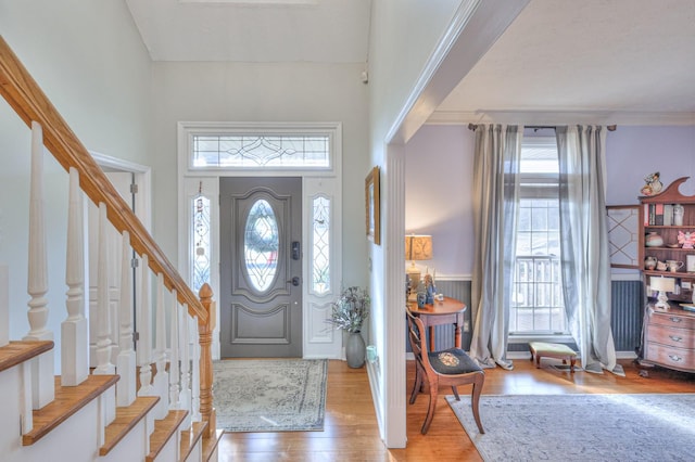 entrance foyer featuring light wood-type flooring and a wealth of natural light